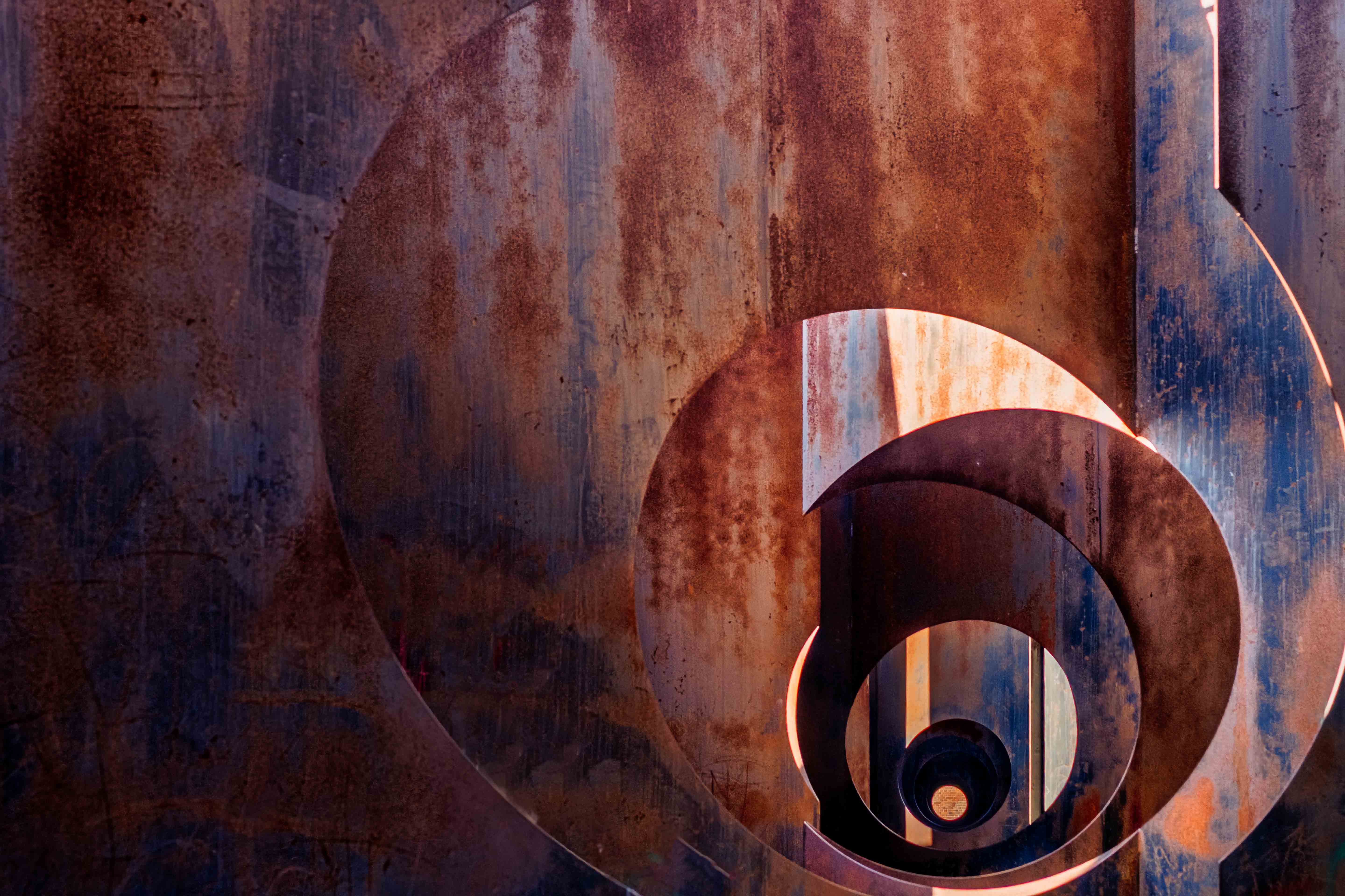 Abstract view of rusted industrial metal spiral at C-Mine, Genk