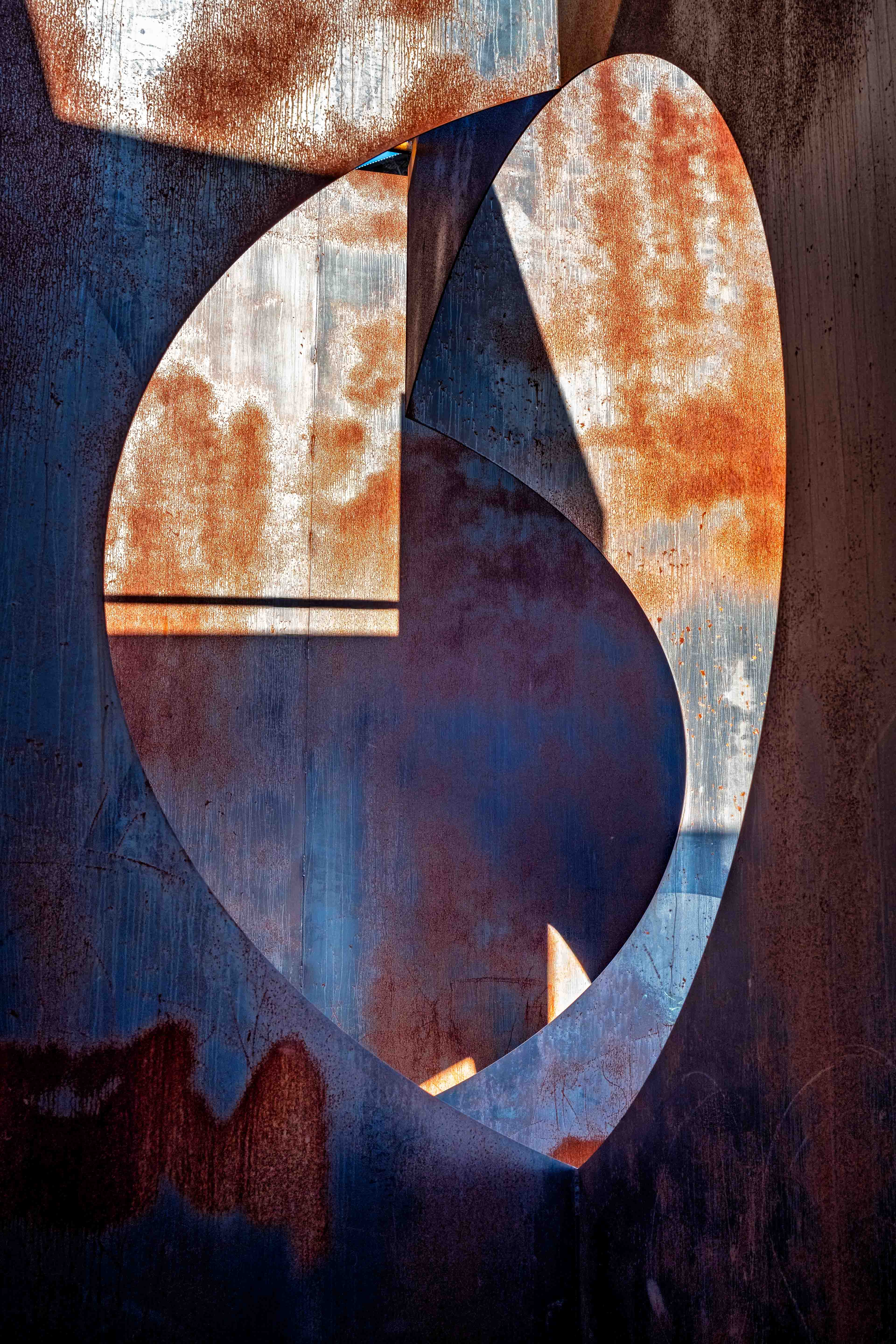 Abstract view of rusted industrial metal with geometric cutouts at C-Mine, Genk