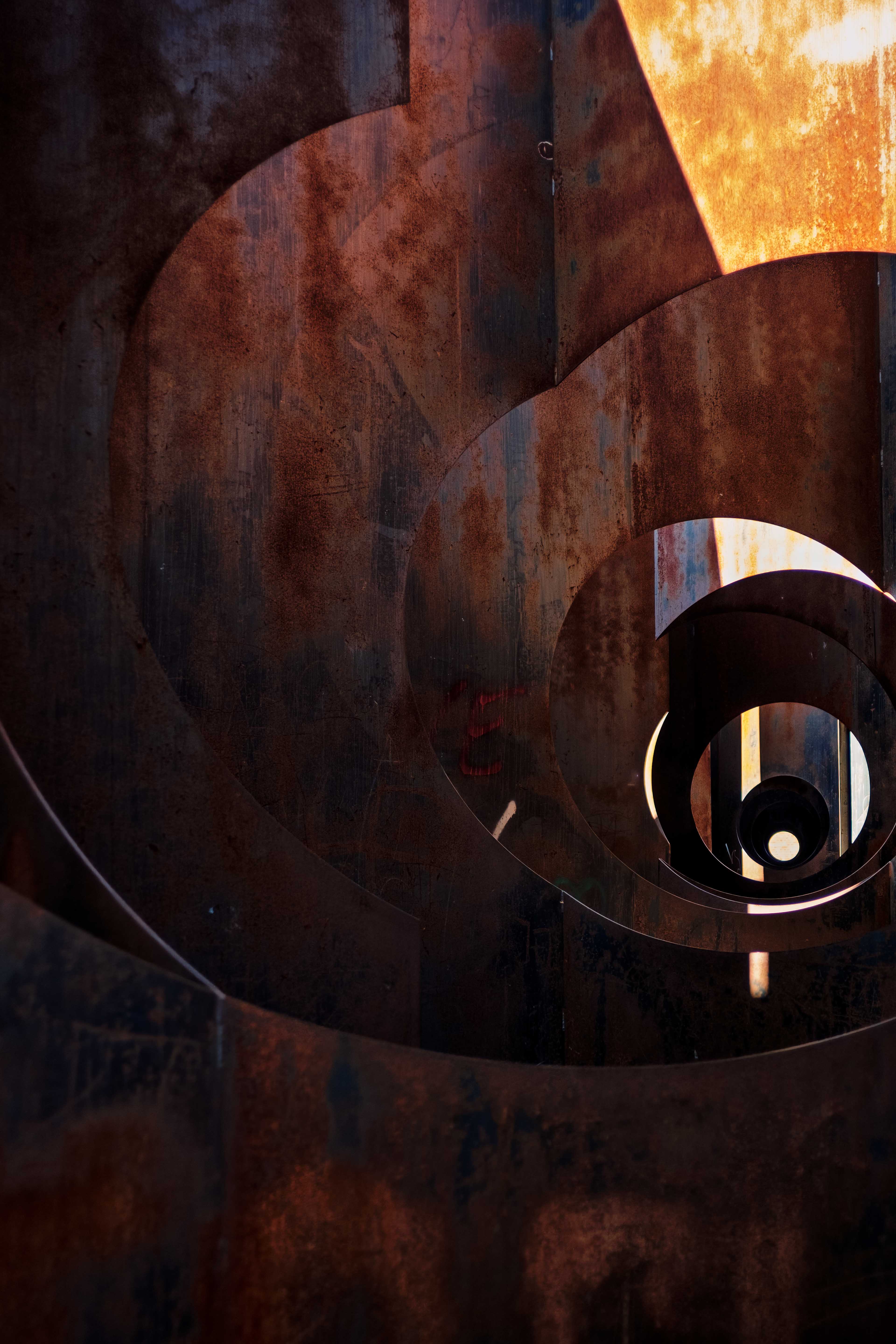 Abstract view of rusted industrial metal spiral at C-Mine, Genk