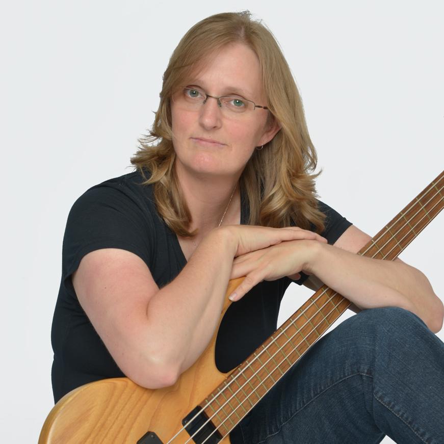 Portrait of photographer Sherry Keene with her original pre-Gibson Tobias bass guitar