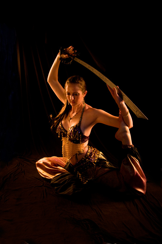 fine art portrait photograph of a belly dancer with a sword